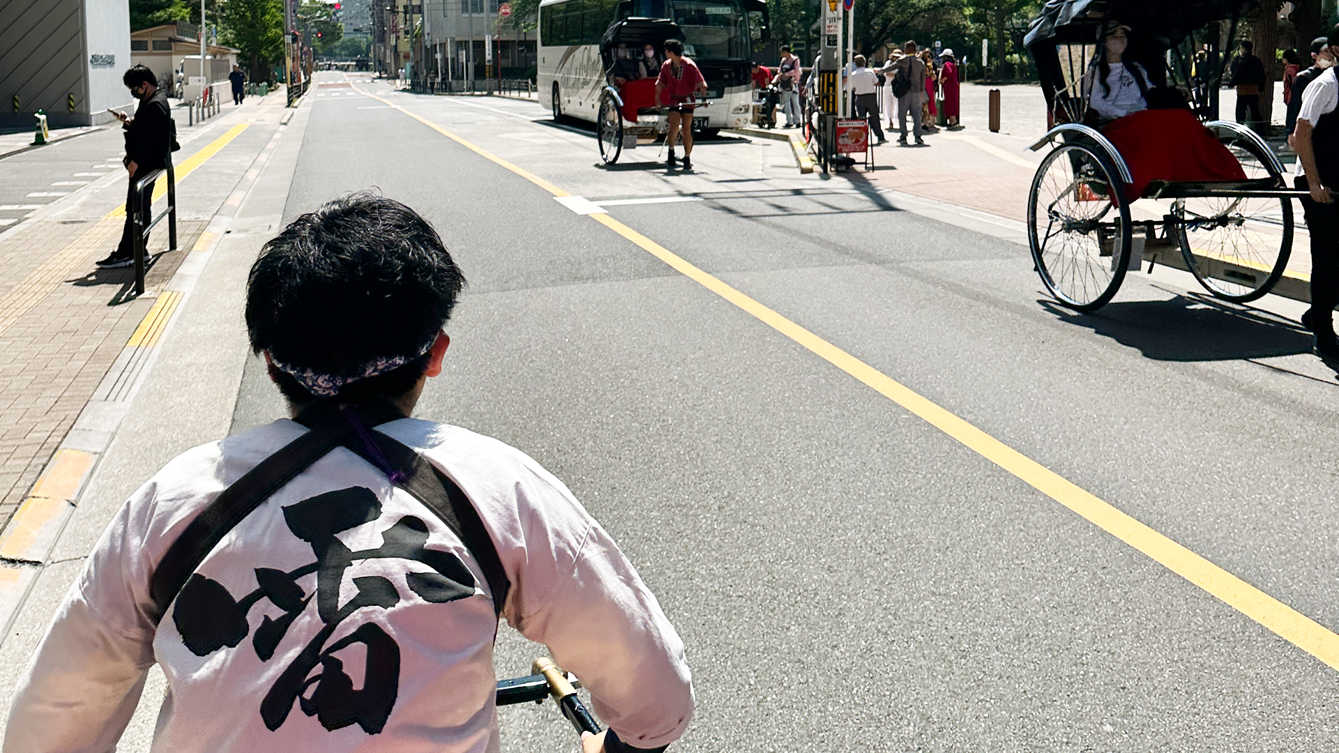 JINRIKISHA (rickshaw) driven by a female driver